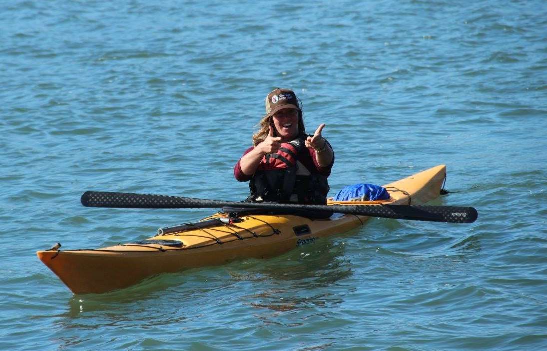 a person rowing a boat in a body of water