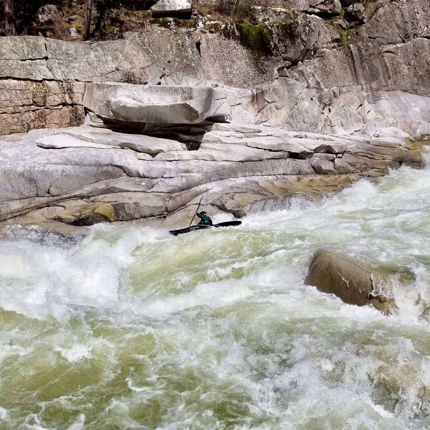 a waterfall in a pool of water