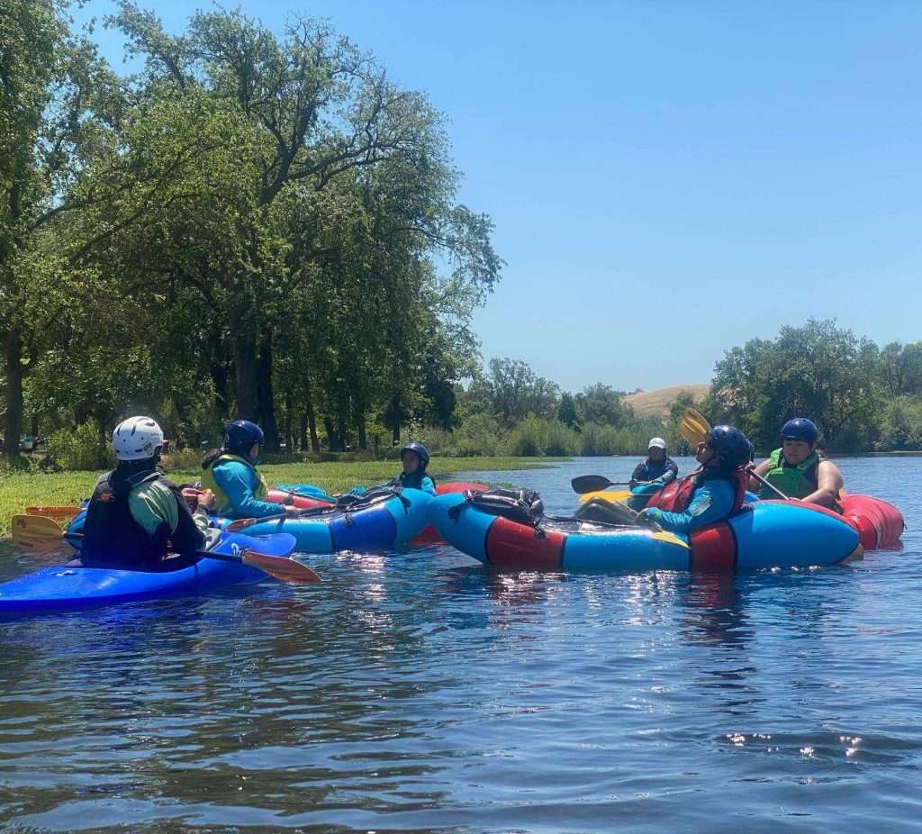 a group of people riding on the back of a boat