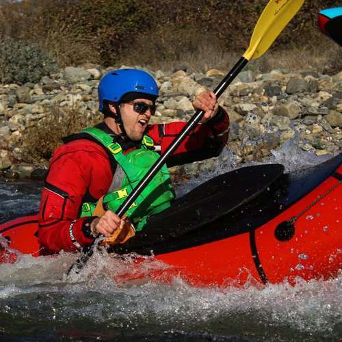 a man in a raft on the water