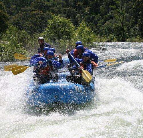 a man riding on a raft in a body of water