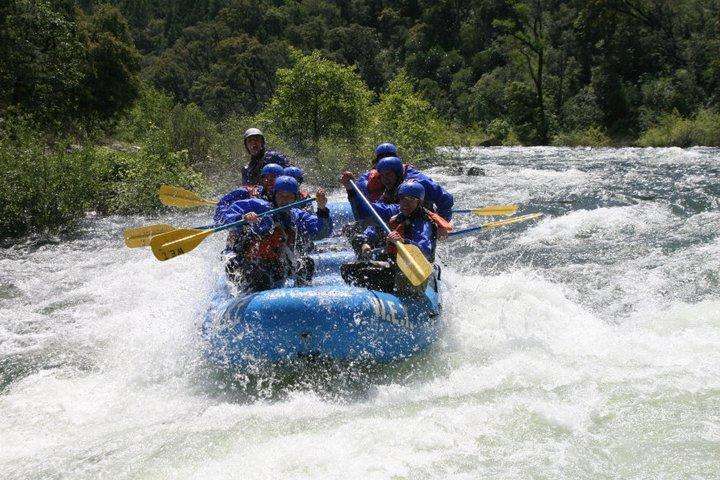 a man riding on a raft in a body of water