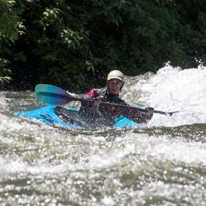 a man riding a wave on top of a body of water