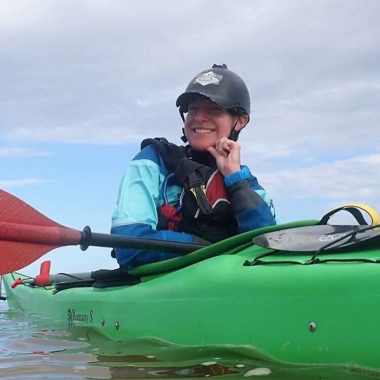 a small child sitting on a boat