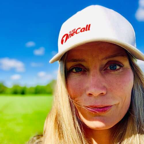 a close up of a girl wearing a hat