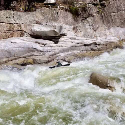 a large waterfall and a pool of water