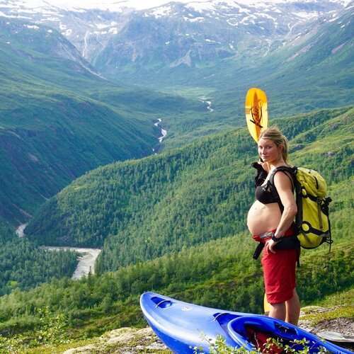 a person standing in front of a mountain