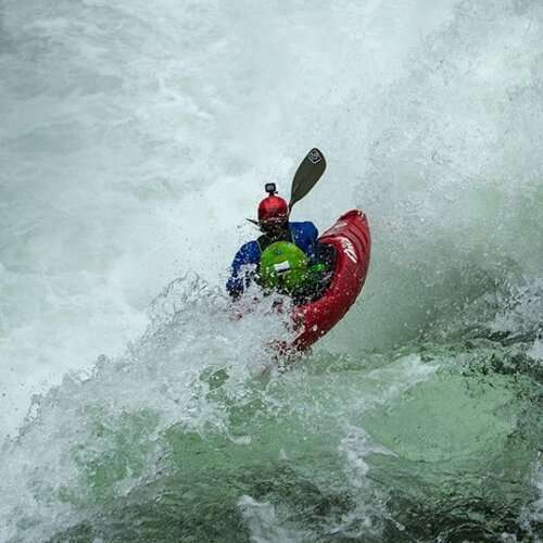 a man riding a wave on a surfboard in the ocean