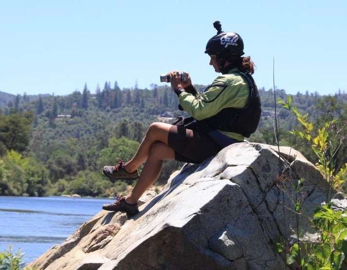 a man sitting on a rock