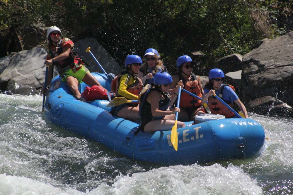 a group of people riding on a raft