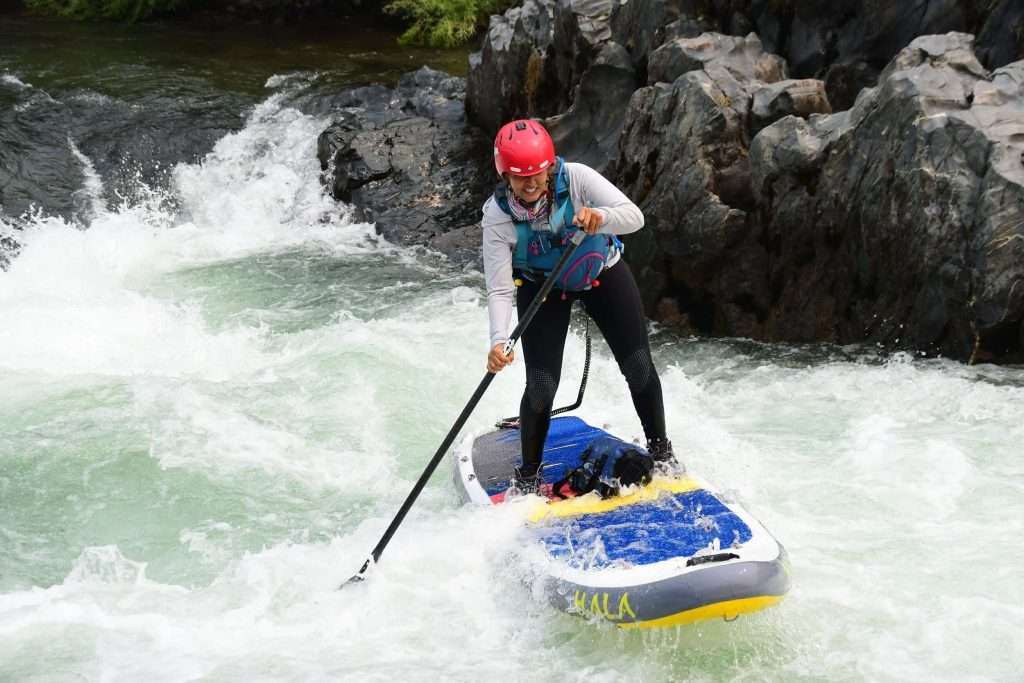 a man riding a wave on top of a body of water