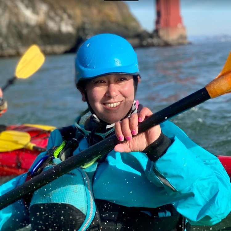 a person riding on the back of a boat