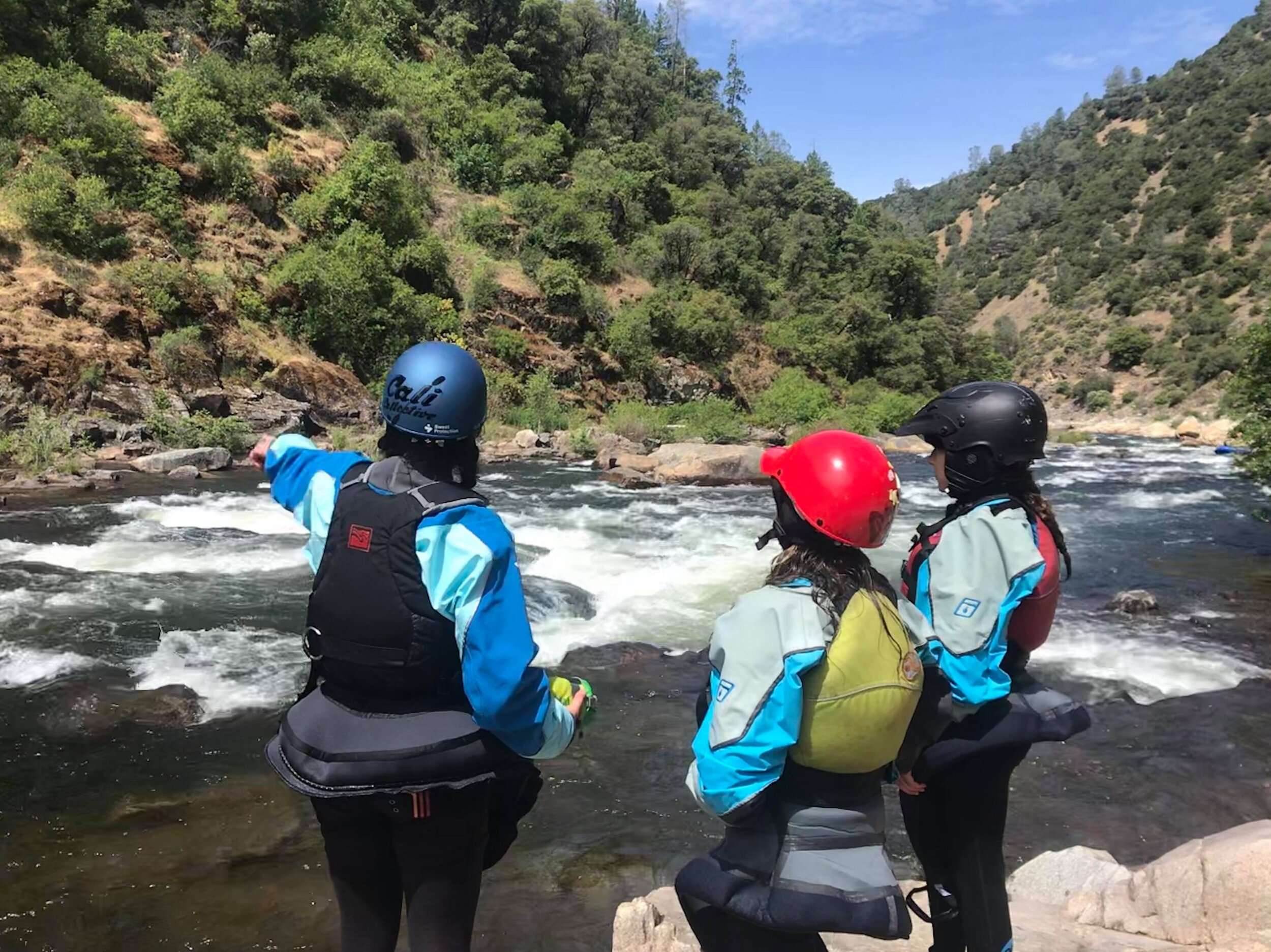 Hannah and her younger sister Maya gets some beta on the first rapid.