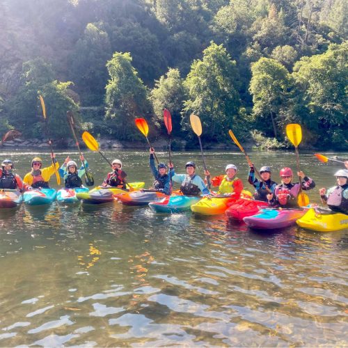 a group of people on a boat in the water